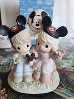 Front view of figurine showing characters and details