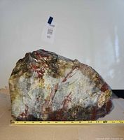 Front view of full stone with measuring tape