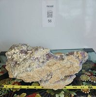 Overall view of fluorite specimen on measuring tape