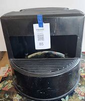 Front view of black Rubbermaid step stool showing overall form and top tread