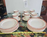 Full set showing plates, cups and saucers