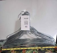 Stack of metal wire hangers front view