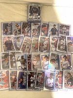 Overhead view of numerous sleeved baseball cards spread out