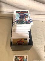 Stack of 2021 Topps baseball cards inside black storage box