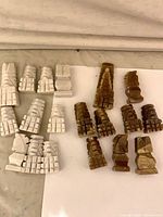 Grouped view of white and brown marble chess pieces