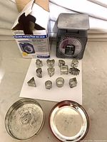 Full lot showing scale, cookie cutters, lids, box