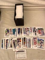 Cards displayed in rows with storage box visible