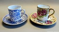 both demitasse cup and saucer sets side by side