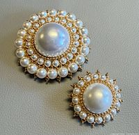 Front view showing both brooches with faux pearls