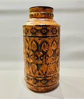 Front view of cylindrical brown glazed vase