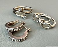 Overview of all jewellery items: bypass ring, knot ring, crystal hoop earrings