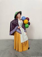 Full view of Royal Doulton Balloon Lady figurine showing colours and condition