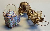 Both items together: teapot and ox cart