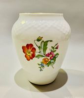 Front view showing main floral design and vase shape