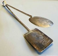 Full view of sterling silver tongs showing paddles and arms