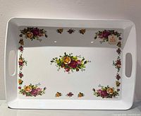 Top view displaying floral pattern, handles and surface condition