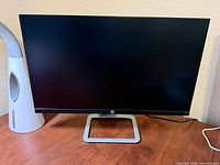 Front view of HP monitor on desk