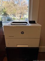 Front view of HP LaserJet Pro M501 printer