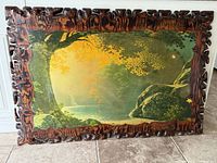 Front view of large carved wood landscape artwork