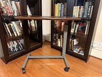 Full view of Invacare overbed table showing top, column, and base