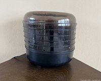 Full view of dehydrator showing stacked trays and base