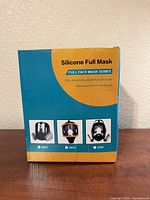 Front of box showing product name and images of compatible mask models
