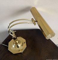 Lamp full view showing octagonal base, curved arms, cord