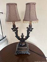 Full view of lamp on table showing both shades and overall height