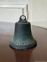 Front view showing Carmel lettering and patina