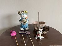 Group shot showing planter, baskets, figurine and picks