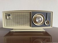Front view of beige Sears Silvertone Solid State radio on pedestal base