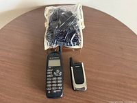 Full view of Motorola handset, Nokia phone, and bagged accessories