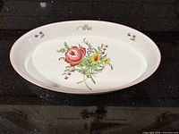Top view of oval baker showing full floral design and pink rim