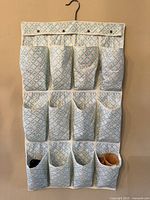 Full view of hanging fabric organizer showing 12 pockets and overall pattern