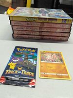 Stacked DVDs showing spines: four Avatar Book 3 Fire volumes and Pokémon Destiny Deoxys