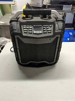 Front view of Ecoxgear rugged Bluetooth speaker showing grille and control panel