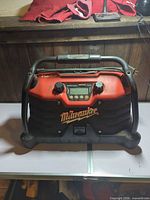 Front view of Milwaukee jobsite radio showing controls and Rockford Fosgate branding