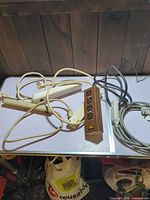 Group of five power strips on table