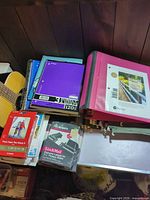 Stack of notebooks, binder, photo paper, Avery labels