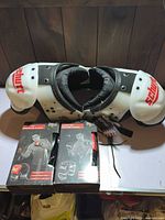 Schutt shoulder pads and two boxed Everlast gloves