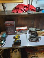 Overall view of six power tools on table