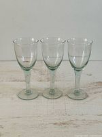 Front view of three wine glasses showing overall design and tint
