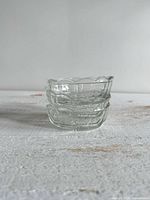 stacked view of three clear glass bowls