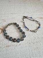 Both bracelets laid flat on white surface