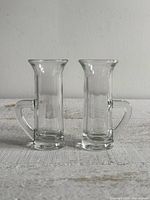 Front view of both clear handled mini shot glasses