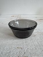 Side view of smoky glass custard cup