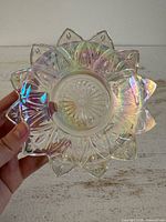 Full view of iridescent flower-shaped glass dish front