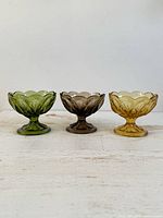 All three colored Fairfield dessert glasses on tabletop