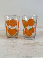 front view showing both orange-print glasses