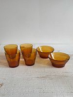 Full set of four tumblers and two bowls on table
